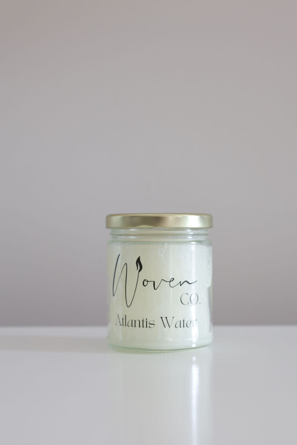 Jar of 'Atlantis Water' by Woven on a white background